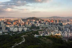 Sunset view on Seoul form Iwangsan Mountain, South Korea photo