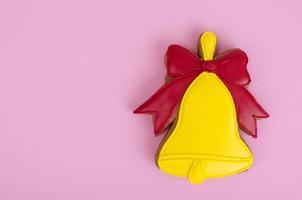 Homemade gingerbread with icing in shape of bells. photo