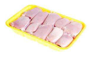 Raw chicken meat in yellow tray. Photo