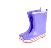 Children's pink rubber boots for walking. photo