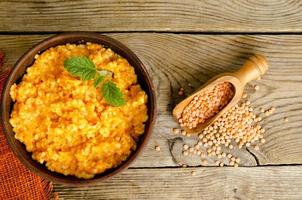 Vegetarian food, porridge with pumpkin and lentils.