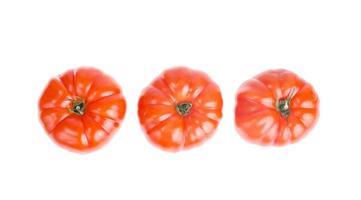 Three red ripe tomato beef. Studio Photo