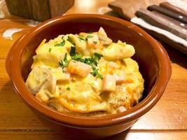 Potato vegetable pancakes with mushroom sauce. Photo