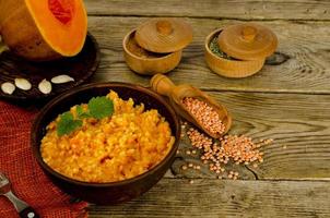 Vegetarian food, porridge with pumpkin and lentils.