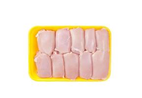 Raw chicken thigh meat without skin in tray. photo