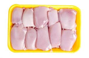 Raw chicken meat in yellow tray. Photo