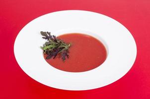 Tomato soup with microgreens. Photo
