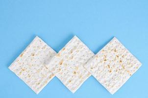 Matzah for passover on blue background. photo