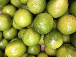 Macro photo green lime fruit. Stock photo fresh citrus lime fruit background