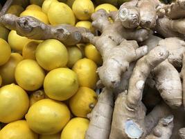 Macro photo lemon and ginger. Stock photo fruits lemons and ginger background