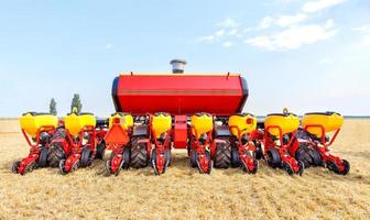 Universal grain seeder as a trailed implement on a tractor. photo