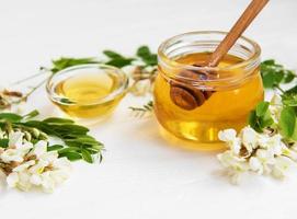 Honey with acacia blossoms photo