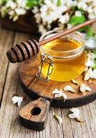Honey with acacia blossoms photo