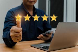 Businessman hand touching five star symbol to increase rating of company concept photo