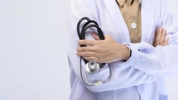 Female muslim doctor with hijab over white background studio. photo