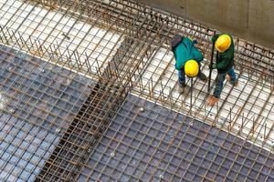 Construction mechanic repairing the structure of steel. photo