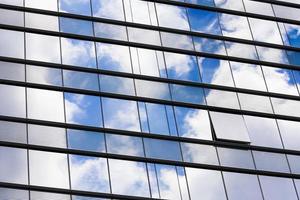 transparent glass windows of office building with reflections photo