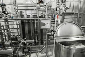 storage and pasteurization tank at the milk factory. equipment at the dairy plant photo