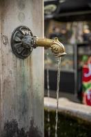 Wall Water Fountain Spout in London, England. photo