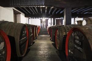 Madeira, Portugal - February 17, 2020 - Detail of Blandy's wine storage of vintage Madeira wine in Portugal. It is a family-owned wine company founded by John Blandy in 1811. photo