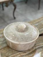 Decoration like a bowl with a lid made of marble for the interior photo