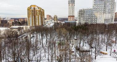 View of the residential complex from the park from a height in winter photo