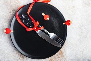 valentine's day table setting cutlery fork, knife, plate holiday decoration love date photo