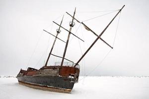 Old Abandoned rusty Sailboat photo