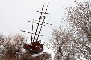 Old Abandoned rusty Sailboat photo