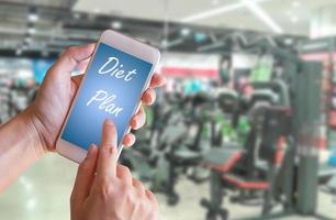Hand holding smart phone with Diet Plan