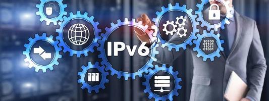 IPv6. Businessman pressing touch screen interface and select icon Internet Protocol photo