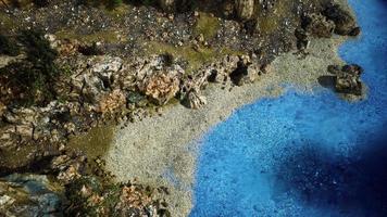 aerial view from flying drone of rocky island in Atlantic ocean photo