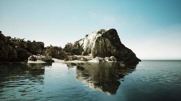 aerial view from flying drone of rocky island in Atlantic ocean photo