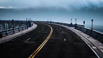 empty bridge fragment near the mountains photo