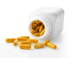 Turmeric Capsule on white background photo