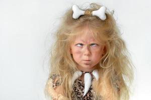 Little girl dressed as a prehistoric caveman photo
