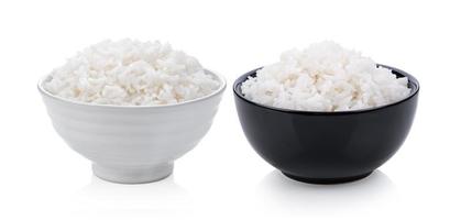 Cooked rice in ceramic bowl on white background photo