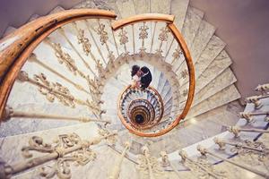 Just married couple in a spiral staircase photo
