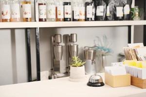 cafe counter with flower and service Ring bell For call waiter at bar front desk photo