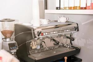 professional coffee machine in italian restaurant. sunny place, good morning, cafe ready for service. coffee making device photo