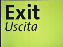 Exit sign in English and Italian photo