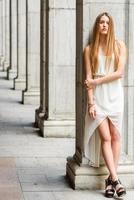 Beautiful blonde girl in urban background photo