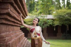 Beautiful Woman wearing typical Thai dress photo