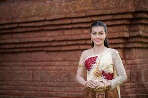 Beautiful Woman wearing typical Thai dress photo