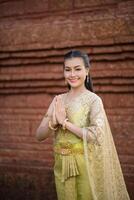 Beautiful Woman wearing typical Thai dress photo