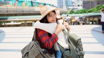 Traveler backpacker Asian women lesbian lgbt couple travel in Bangkok, Thailand. Happy young female spending holiday trip at amazing landmark and enjoy her journey in traditional city. photo
