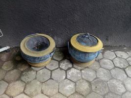 two trash cans made from old rubber tires photo