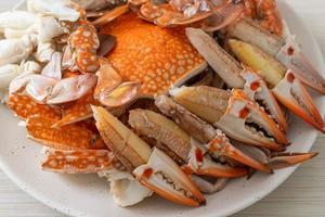 Steamed blue crab with spicy seafood sauce photo