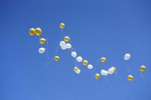 Colorful balloons in the air photo