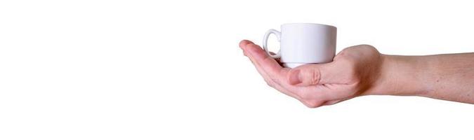 Man holding a white cup of espresso coffee on a white background. photo